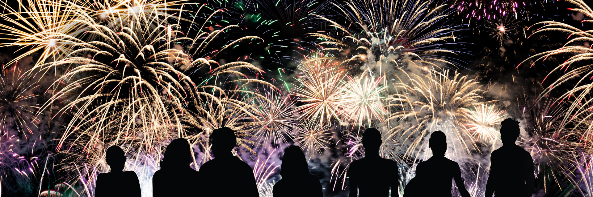 Spectacular New Year’s Eve fireworks lighting up the night sky in Dublin, viewed by a crowd near The Grafton Hotel